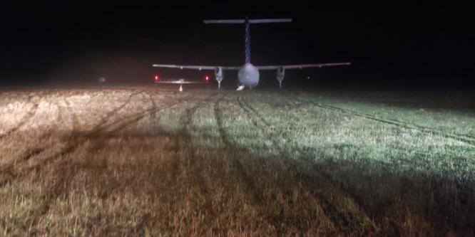 Figure 2. Occurrence aircraft after the runway overrun, photo taken from the end of the paved surface of Runway 12 (Source: Porter Airlines Inc.)